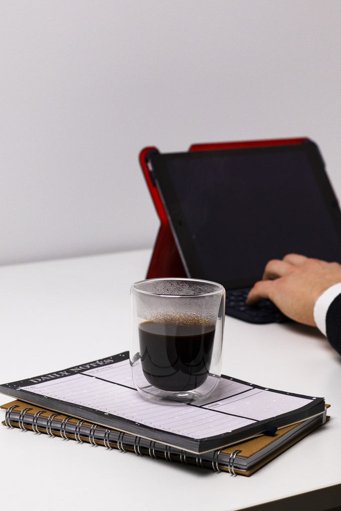 man working while enjoying nice cup of coffee